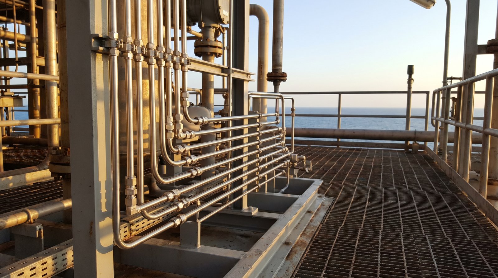 Stainless steel instrumentation tubing on an offshore oil platform skid.